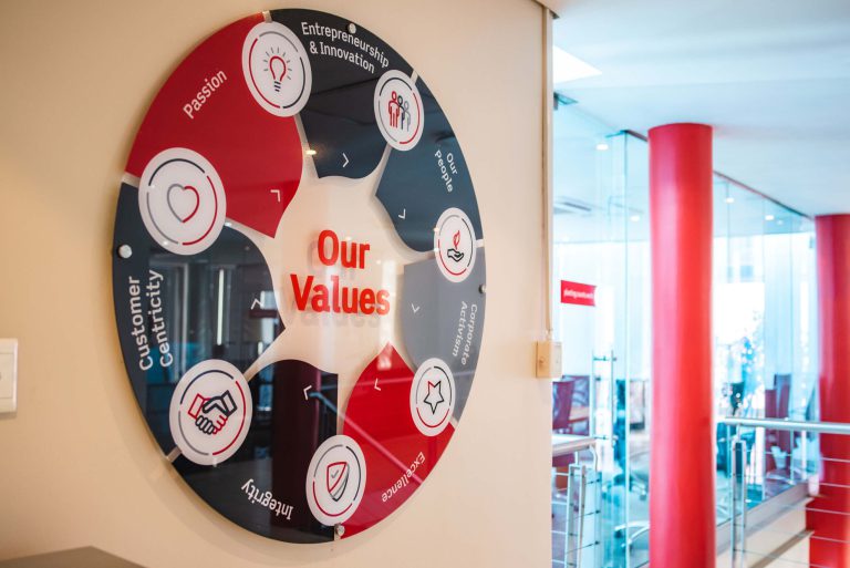 Aramex round interior glass signage by Three6ixty