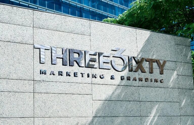 A professional Three6ixty Marketing & Branding signage image, featuring the company logo mounted on a modern stone wall outside a commercial building, representing a polished corporate branding presence in South Africa.